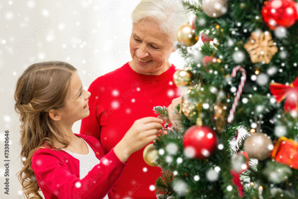 smiling family decorating christmas tree at home smiling family decorating christmas tree at home