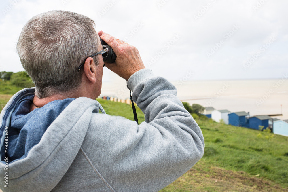 Senior man with binoculars Senior man with binoculars