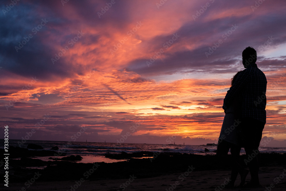 Couple in a sunset at beach