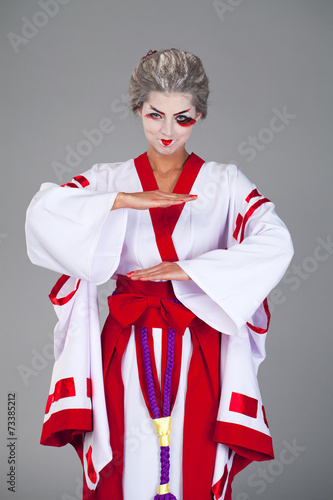 Beautiful young woman in white kimono