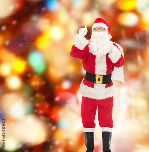 man in costume of santa claus with bag