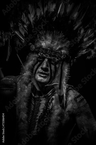 traditional Native, American Indian chief with big feather headd photo