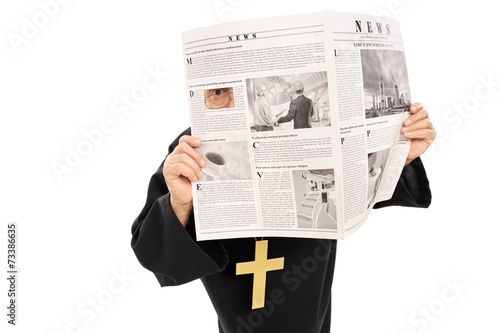 Sneaky priest peeking through a hole in newspaper