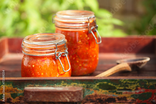 Jar of home made classic spicy Tomato salsa photo