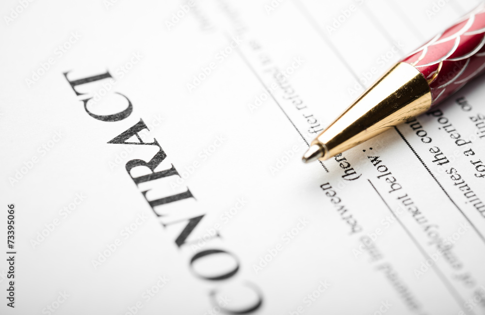 Pen on the contract papers Pen on the contract papers