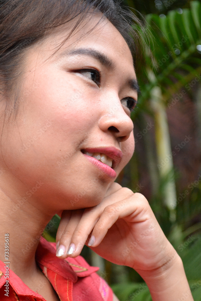 smiling young woman in traditional clothing from Laos smiling young woman in traditional clothing from Laos