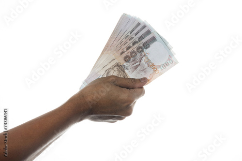 Hand holding Thailand money bills