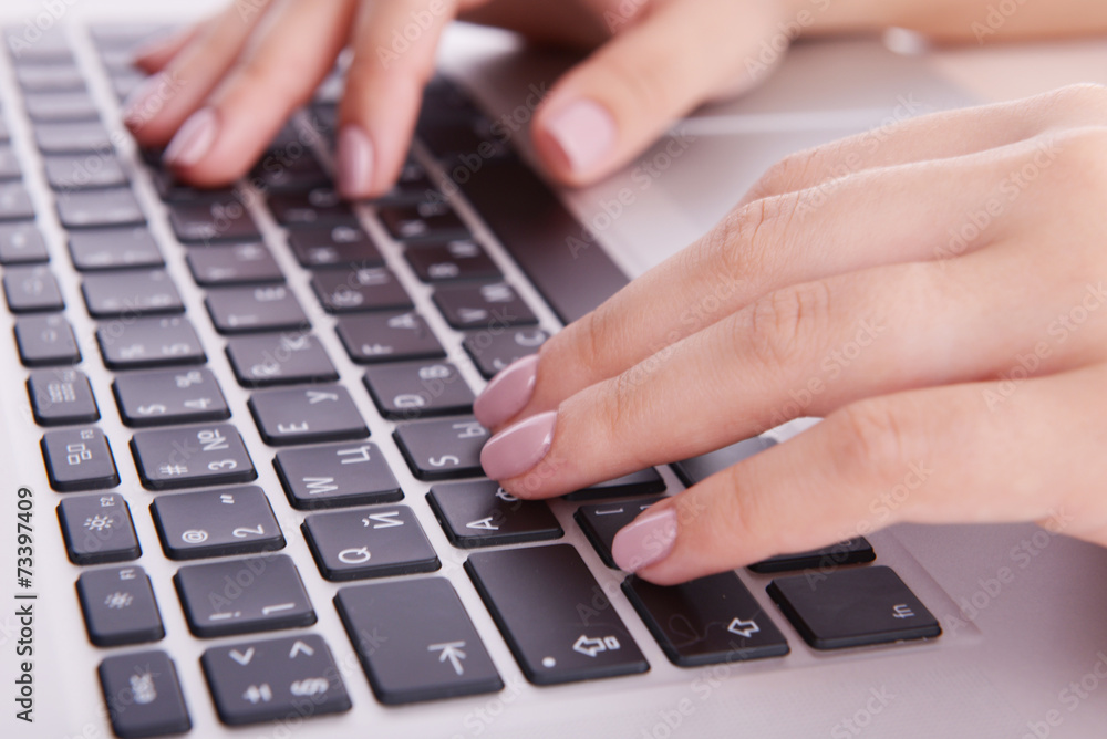 Female hands working on laptop close up Female hands working on laptop close up