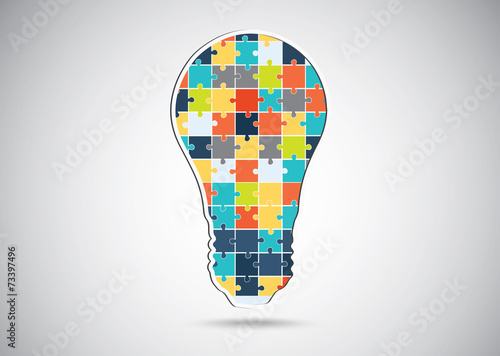 Puzzle piece light idea bulb.