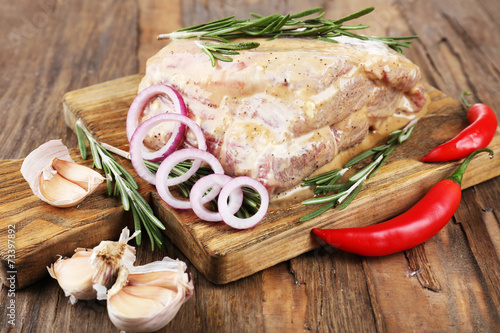 Raw meat on wooden table, close-up