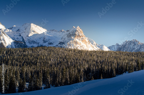 winter mountain with snow cover in sunset, colorado