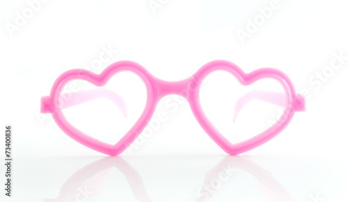 Heart shape frame glasses on white background