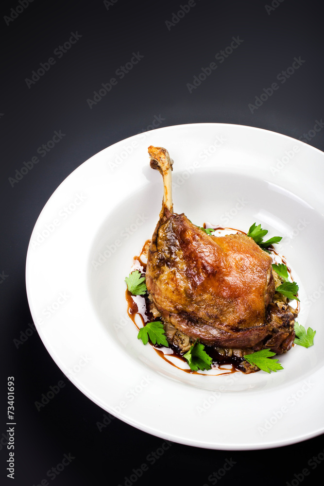 Glazed Christmas roast duck seasoned with oil, herbs, fig and an Glazed Christmas roast duck seasoned with oil, herbs, fig and an
