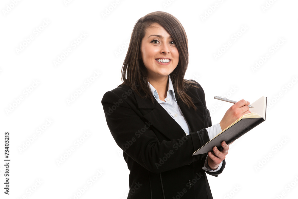 Attractive cheerful assistant writing in notebook Attractive cheerful assistant writing in notebook
