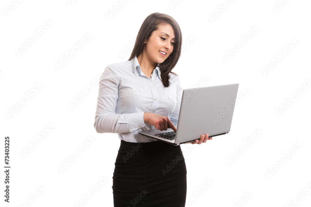 Attractive office worker holding and looking at laptop screen Attractive office worker holding and looking at laptop screen