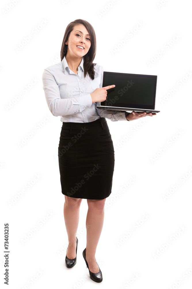 Attractive woman pointing at blank laptop screen Attractive woman pointing at blank laptop screen