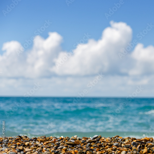 Bright picture of seashore with blue sky and sea