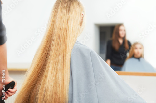 Blonde hair. Woman in hair salon