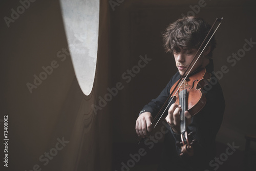 young handsome blonde violinist photo