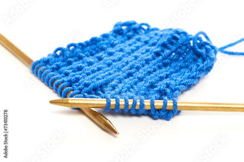 Two spokes with knit blue woolen cloth isolated macro