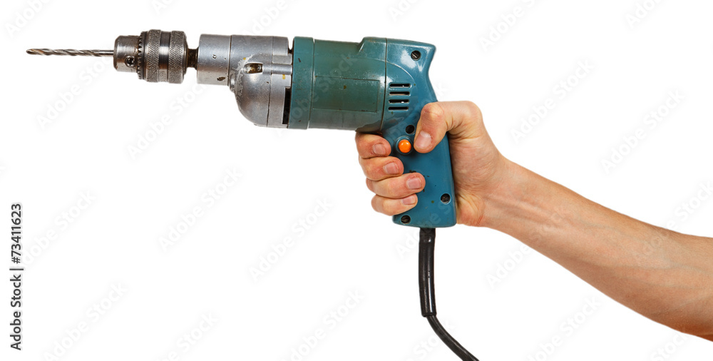Man's hand holds a drill Man's hand holds a drill