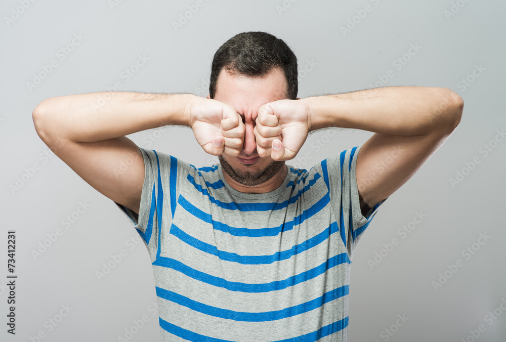 Man covering his hears Man covering his hears