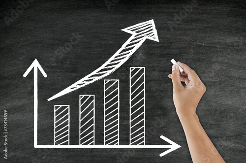 hand writing growing graph and arrow