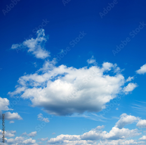 white fluffy clouds in the blue sky