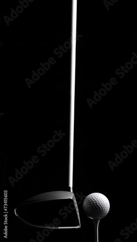 Golf Wood with a Golf Ball and Golf Tee Isolated on Black