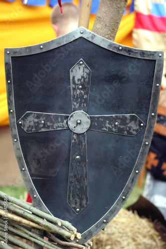 Knight's metal shield with christian cross