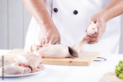 Close up Chef prepared cutting chicken head