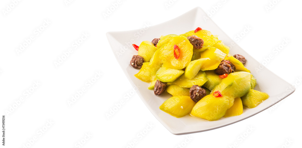 Pickled young mango with dried tamarind and chili slices Pickled young mango with dried tamarind and chili slices