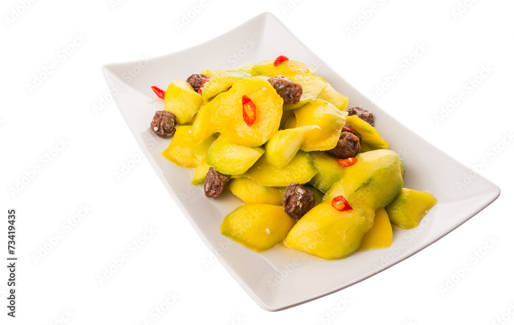 Pickled young mango with dried tamarind and chili slices Pickled young mango with dried tamarind and chili slices