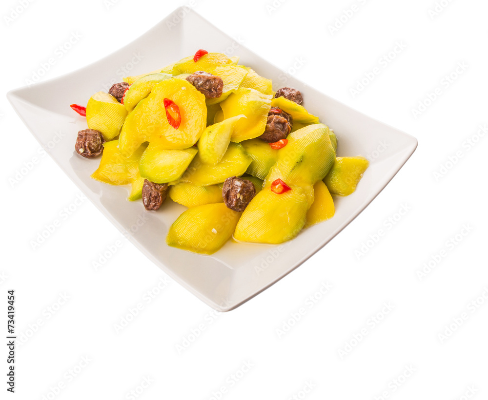 Pickled young mango with dried tamarind and chili slices Pickled young mango with dried tamarind and chili slices