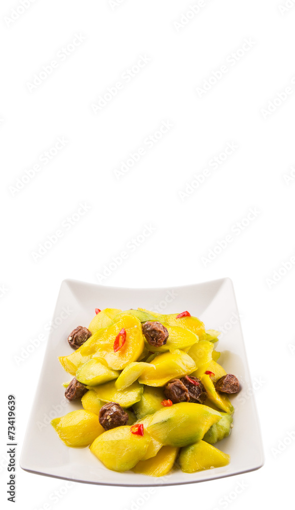 Pickled young mango with dried tamarind and chili slices Pickled young mango with dried tamarind and chili slices