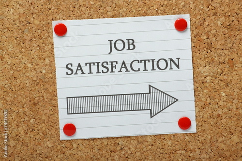 Job Satisfaction This Way sign on a notice board