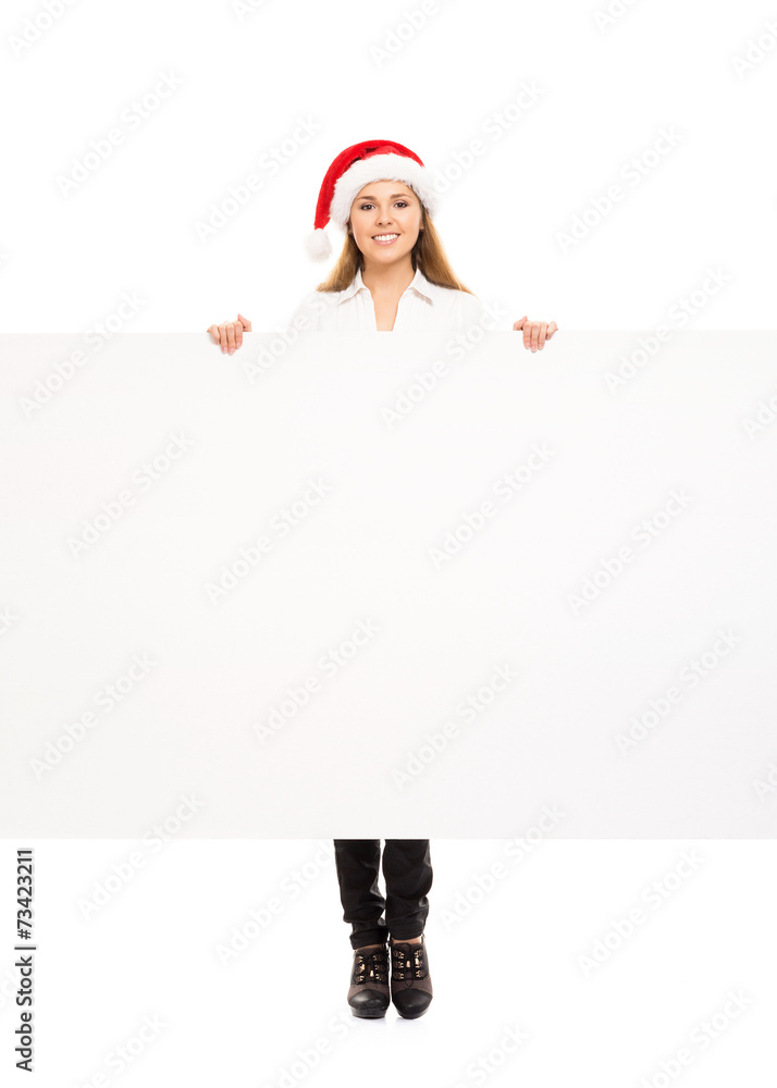Teenage girl with a blank billboard and a Christmas hat Teenage girl with a blank billboard and a Christmas hat