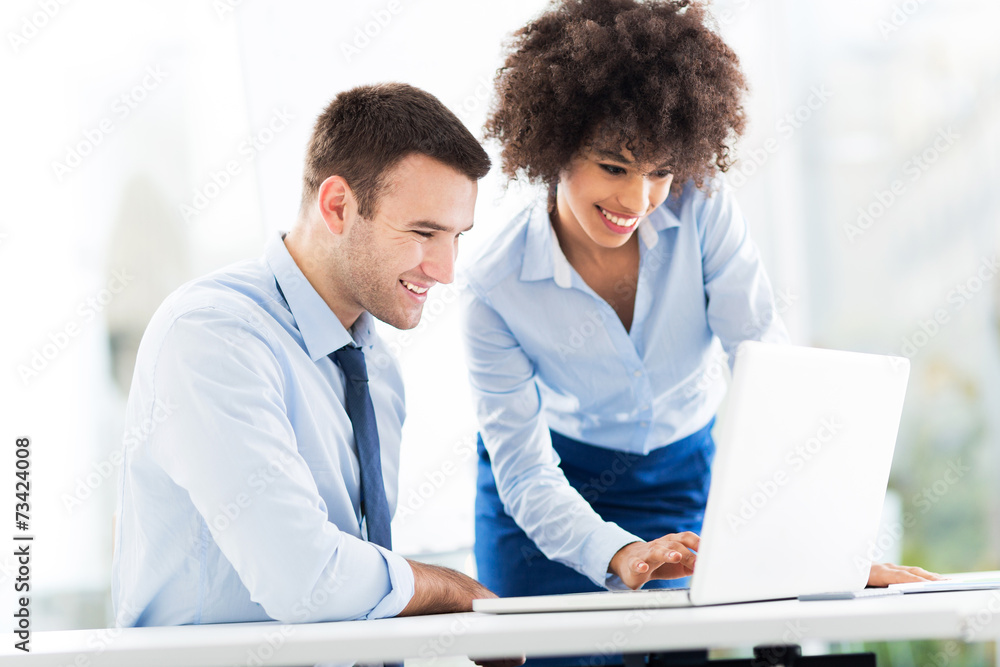 Business people looking at laptop Business people looking at laptop