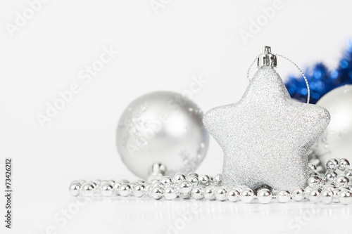 Sparkling Christmas background with silver Christmas decorations