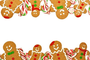 Christmas frame of colorful gingerbread men and candies