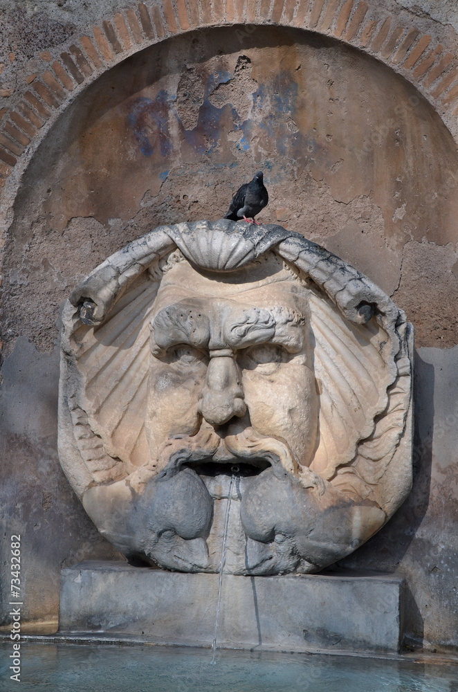 Mask Fountain at Santa Sabina in Rome