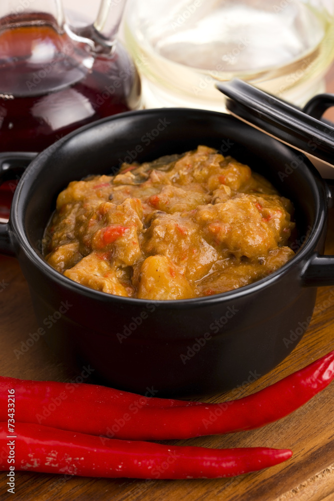 homemade hot goulash on wooden table homemade hot goulash on wooden table