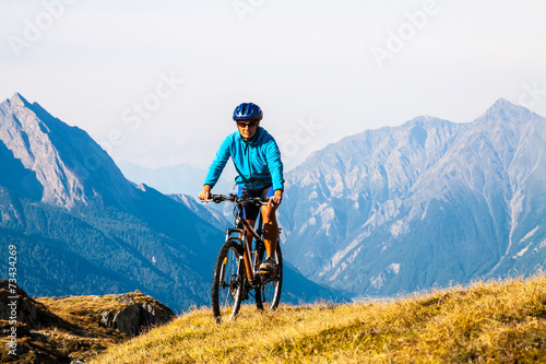 Cyclist woman in hight mountais