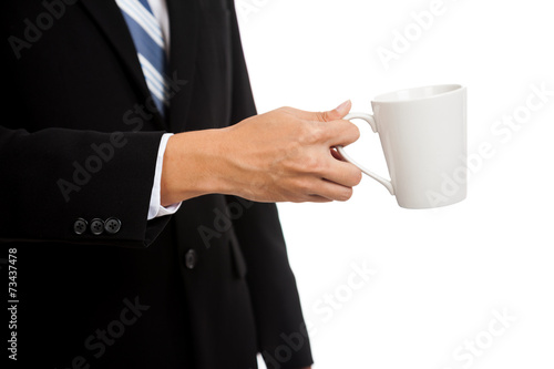 Asian businessman hold a cup of coffee