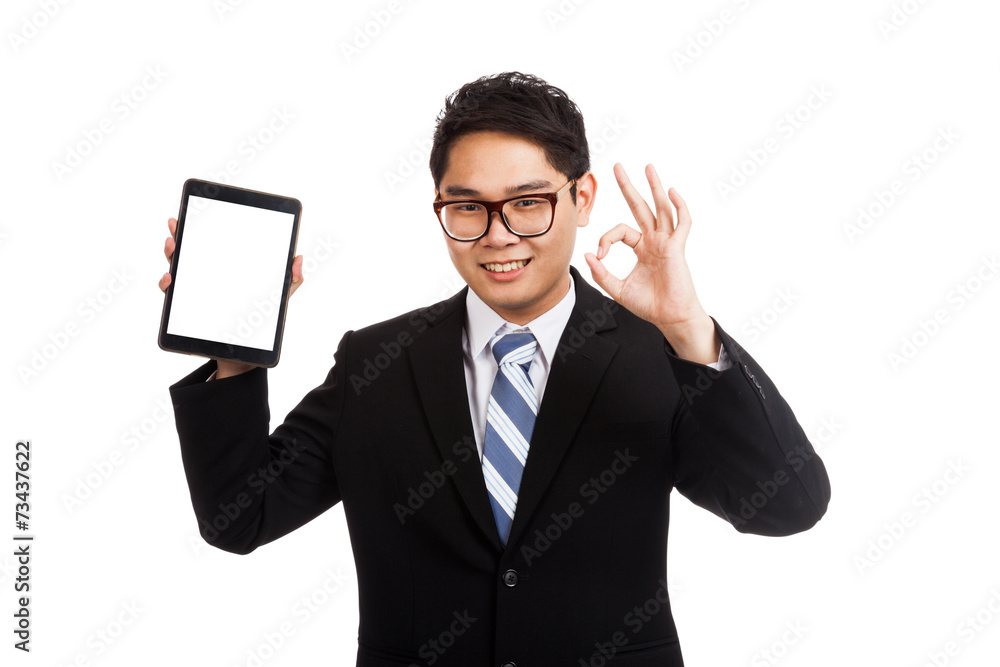 Asian businessman show OK with tablet pc Asian businessman show OK with tablet pc