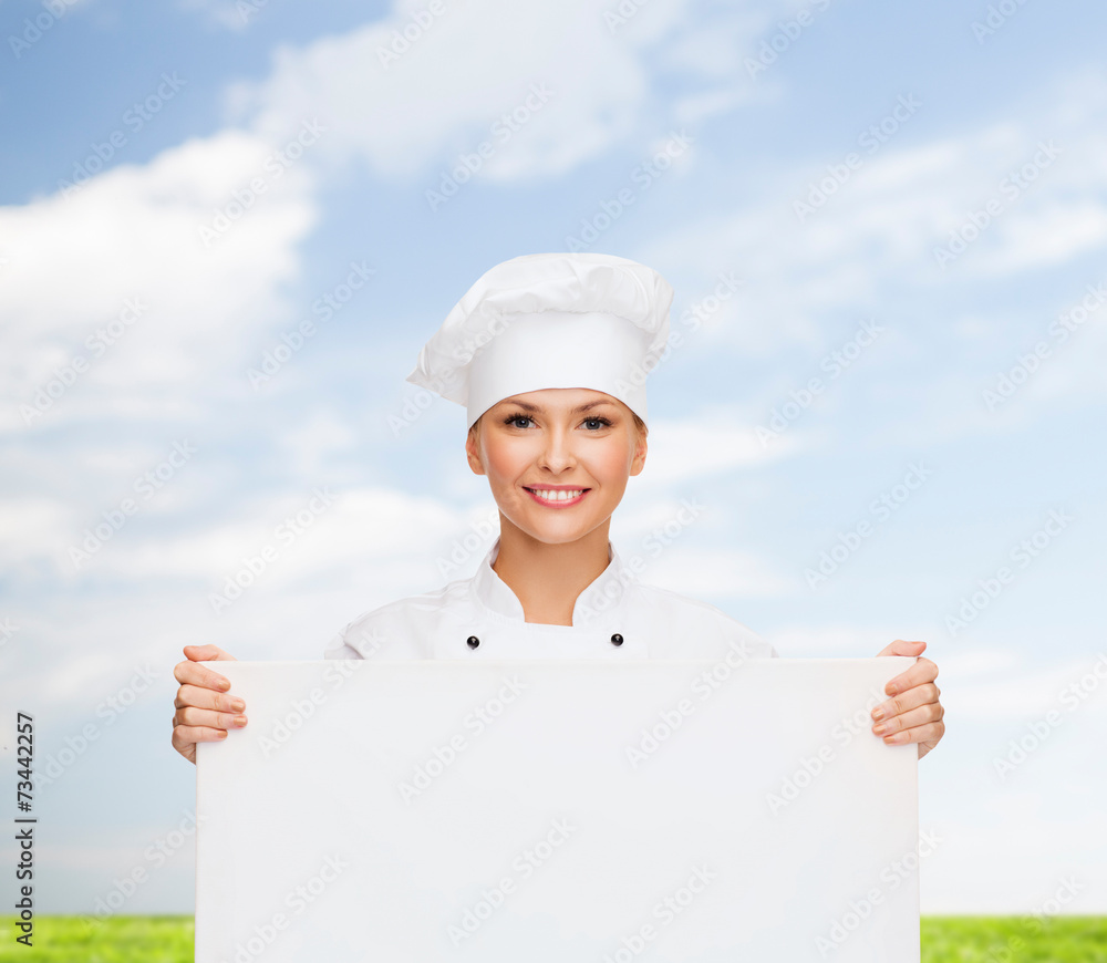 smiling female chef with white blank board smiling female chef with white blank board