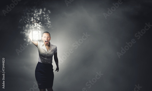 Businesswoman with lantern