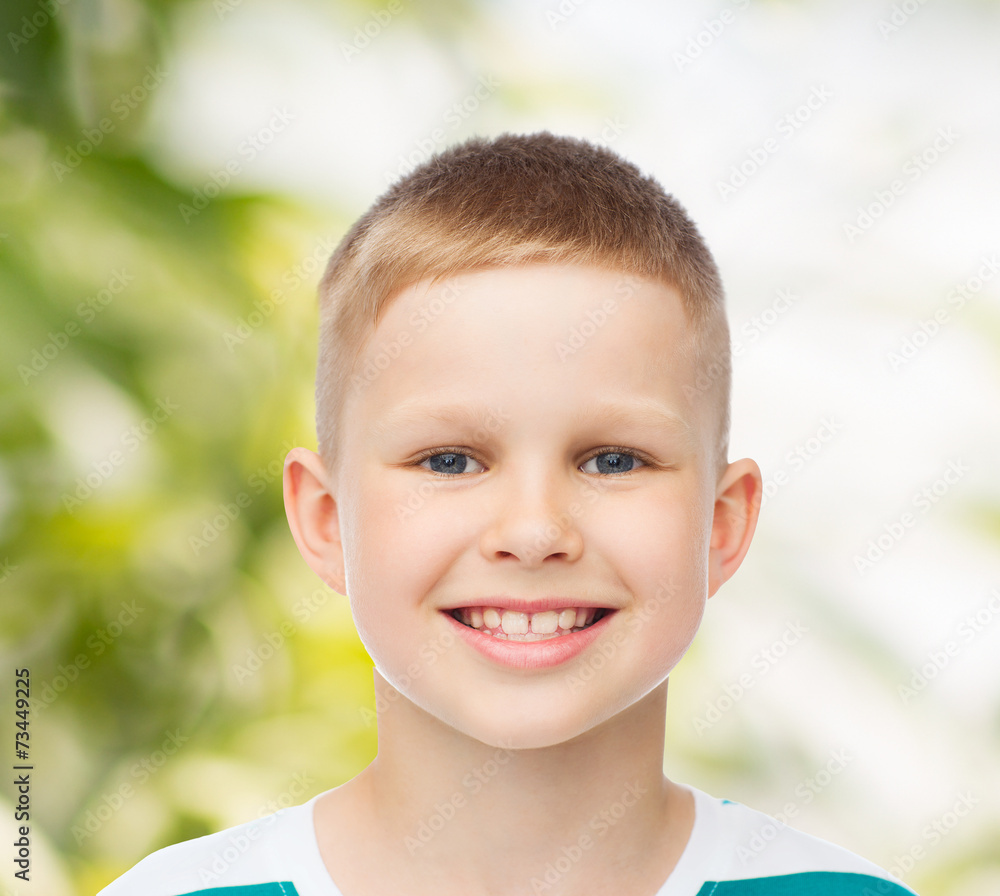 smiling little boy over green background smiling little boy over green background