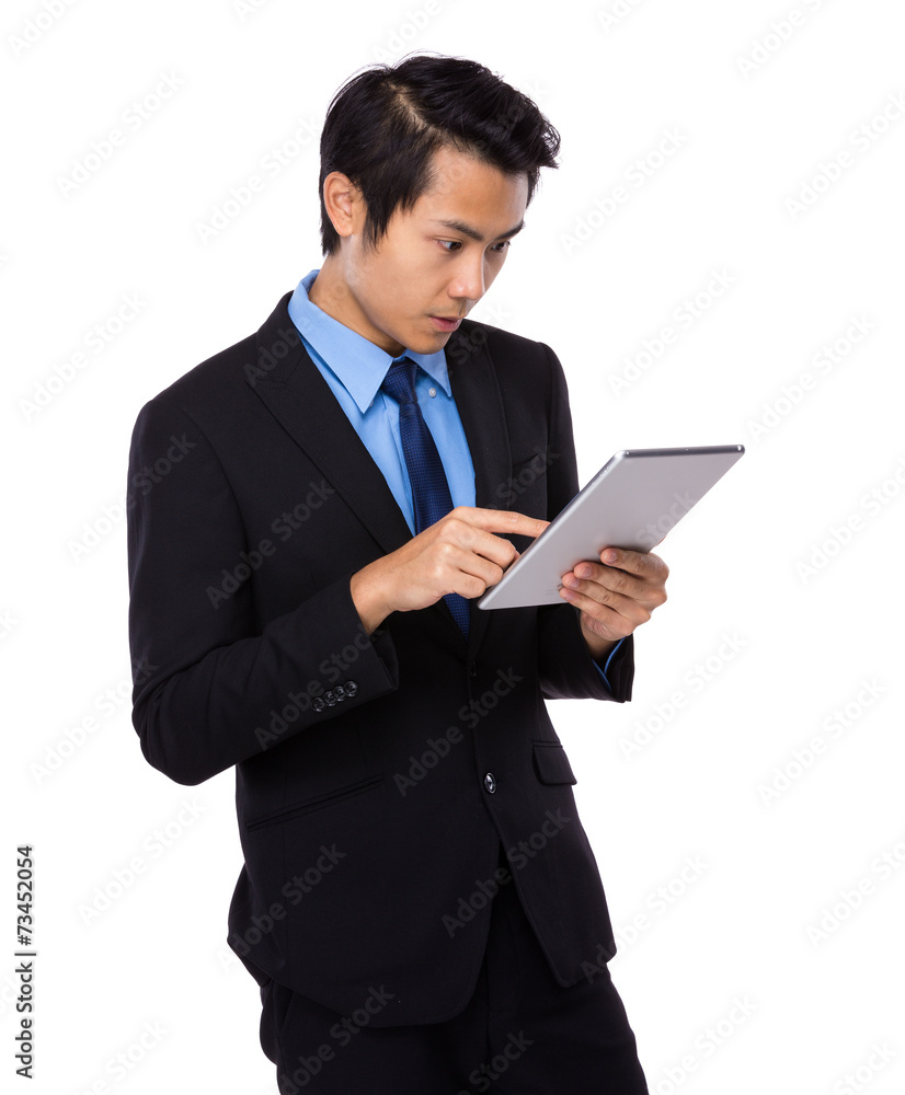 Businessman look at digital tablet Businessman look at digital tablet
