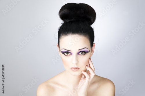 Professional makeup and hairstyle beautiful young woman close up